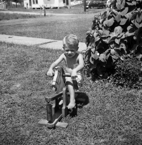 At the Green House on the rocking horse my dad built for me, summer, 1953.